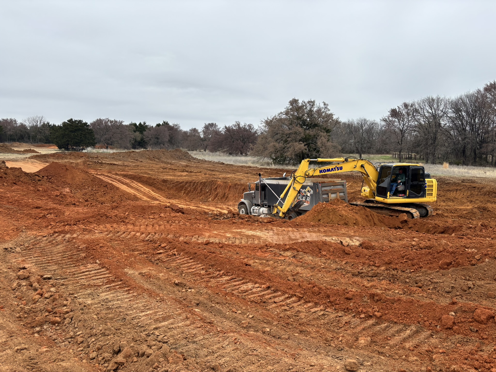 Site development dirt work equipment preparing land for construction